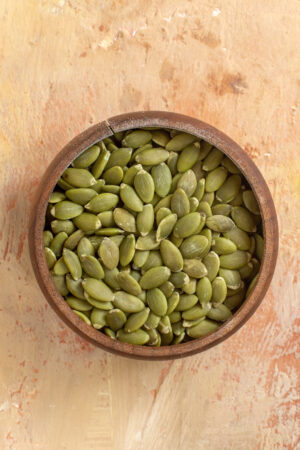 Bowl of fresh premium pumpkin seeds by Pyazon – healthy superfood for snacks and recipes